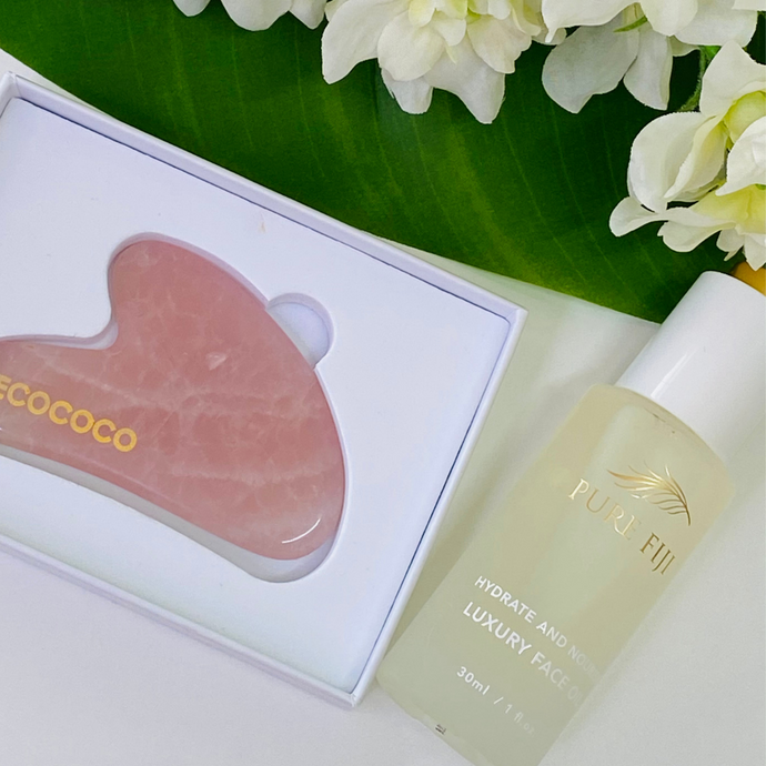 Gua Sha Rose Quartz Crystal Improves Circulation, Reduces Inflammation, and aids in healing. Adding the Pure Fiji Hydrating and nourishing oil  brings you the Power of 5 with our unique botanical blend of organic cold-pressed oils, Coconut, Macadamia, Sikeci, Dilo and Moringa oil. This supercharged anti-aging blend of oils is full of antioxidants, essential fatty acids and vitamins to hydrate, nourish and smooth skin while restoring radiance leaving skin with a youthful glow.